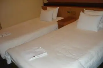 Hotel beds are great because you don't have to make them in the morning! (Photo: Vika)