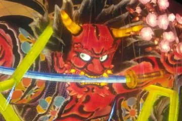 A fierce-looking devil trapped in plastic.