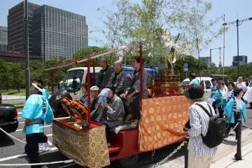 You can just spot the monkey decorating this float through the tree branches