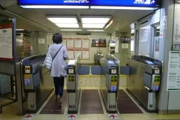 Train ticketing gates - slide your ticket or card into the slot, and it pops out the other side! (Photo: Japan Tourist Osaka)