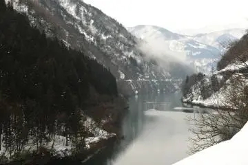 When I was walking down the street along the river to the village the mist went up the mountains in the far distance
