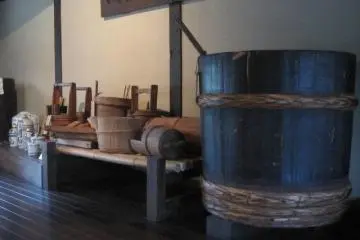 Sake vats displayed in the Shuyukan - the sake store and musem. (Photo: Justin W. Dart)