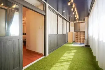 A carpeted hallway in a Borderless House