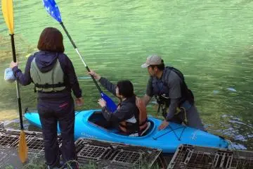It's hard to keep the balance and the kayak shakes when you get on, but the instructor can hold it for you. &nbsp; (Photo: Bonson Lam)
