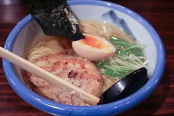 Shio ramen is characterized by its transparent broth and light taste (topped with grilled chaashuu, tamago, nori, and some greens)... (Photo: <a href="http://en.japantravel.com/view/yuzu-ramen-at-afuri" target="_blank" rel="noreferrer noopener nofollow">Tom Roseveare</a>)