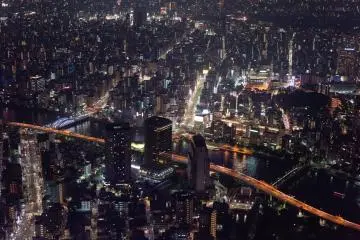 The Tokyo Skyline by Day Or Night
