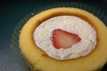 Premium Roll Cake with a Cut Strawberry on Top (Photo: Lawson)