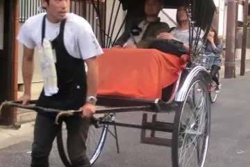 rickshaw and driver wearing "happi"