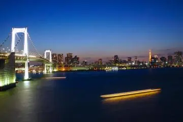 Trails of ships passing below the rainbow bridge with Tokyo Tower in the distance (Photo: Manish)
