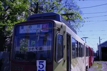 Stopping for a chat with a local by the tram depot