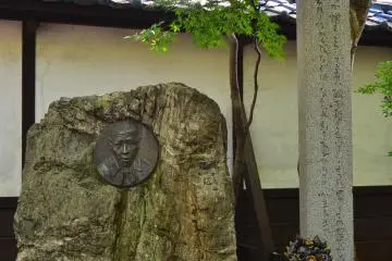 Main memorial statue and little monument to Kenji Miyazawa.