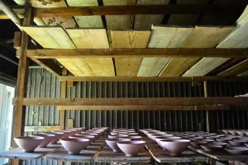 Teabowls that are ready to be fired inside the kiln.