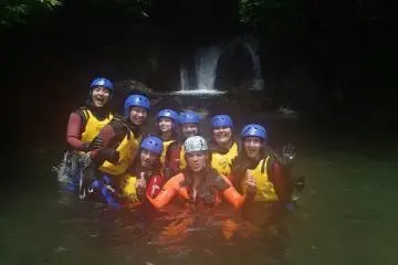 Feeling victorious after completing the canyoning course, we took a picture with our guide, Lee. (Photo: Canyons Japan)