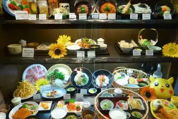 Restaurants will tempt you inside with their colorful food displays in their shop windows