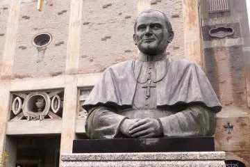 A bronze statue of Pope John Paul II is on display near the entrance to the Cathedral