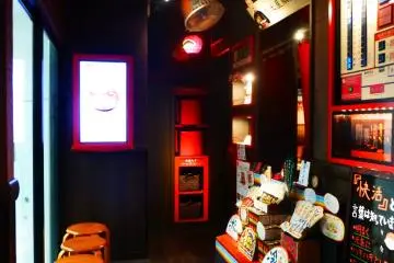 Walk up the stairs, buy your meal ticket and head over to your seat