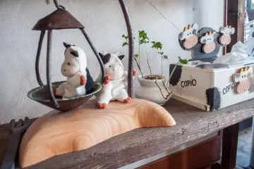 The shop has some locally made trinkets with a cow theme.