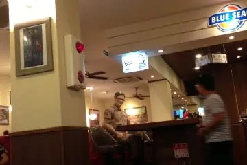 A friendly "Officer" sits at the bar greeting and taking photos with guests. (Photo: Kathryn Spoor )