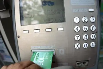 Insert a phone card into the telephone and follow the on-screen instructions.