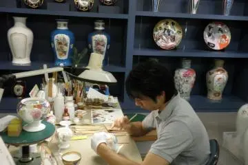 Artists painstakingly hand paint the fine china at Noritake (Photo: Aichi Prefecture)