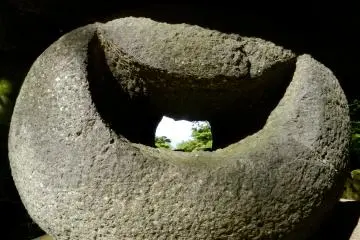 Through the moon-shaped hole in this rock you can see the top of Mount Chokai.