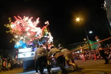 It takes large teams to move the floats through the city.