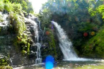At one end of the town, a waterfall cascades into a small, clear lake.