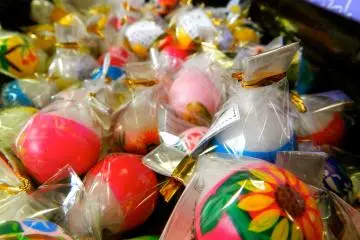 There are so many beautiful candles for sale in the shop.