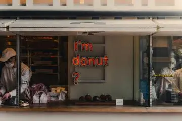 Photo: <a href="https://unsplash.com/photos/a-bakery-window-features-im-donut-text-QqOvmlWc5aE" target="_blank" rel="noreferrer noopener nofollow"> Daniel Akselrod</a> / Unsplash