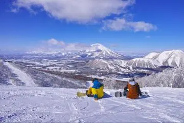 Sitting on the snow overlooking Rusutsu