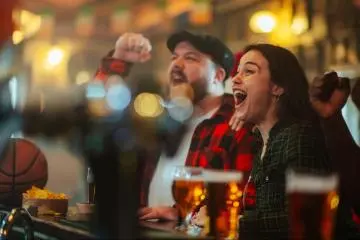Cheering on sports at the pub