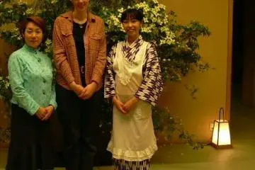 This photo was taken during my first visit to the restaurant. I am in the center;&nbsp;that's my student on my left, and our server on my right. I include it so that you can see the server's kimono (Photo: Gassan Staff)